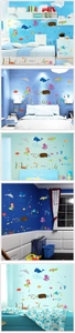 Detail view of colorful cartoon mermaid and whale ocean wall stickers for nursery decor
