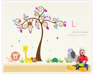 Detailed wall sticker layout featuring cartoon safari animals and a colorful tree on a white wall