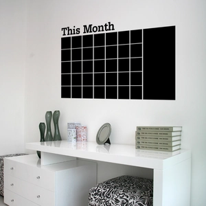Minimalist black monthly calendar wall sticker with memo section on white wall