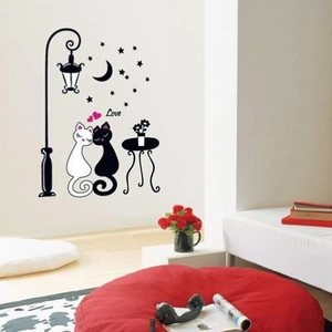 Detail of cartoon black and white cat wall stickers with romantic street lamp scene