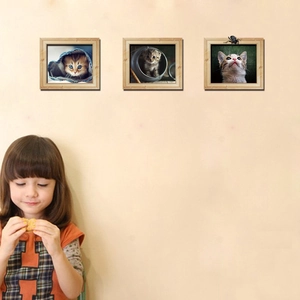 Three-piece wall art set with cute cat photos in light wood frames for home decoration