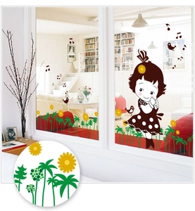 Detailed view of girl decal with sunflowers and birds on a glass window surface