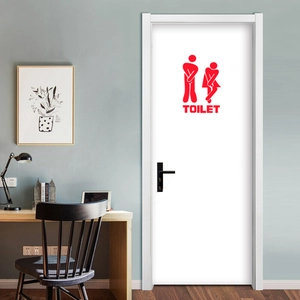 Close-up of red funny cartoon toilet door sticker with bold TOILET text on white door