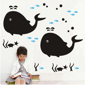 Detail of whale wall stickers set with small blue fish and bubbles in kids room
