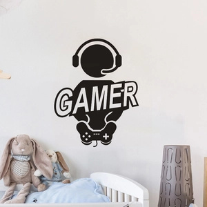 Detail showing creative black GAMER wall decal with gamepad and headset in cozy bedroom