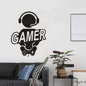 Detail of black gamer wall sticker featuring headset silhouette and controller design