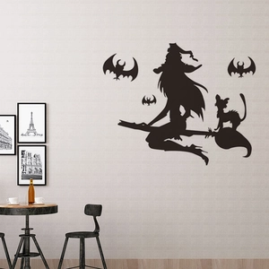 Halloween vinyl wall sticker featuring a flying witch silhouette and black bats on a light wall