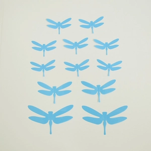 Set of 12 light blue 3D dragonfly wall stickers in various sizes for home decoration
