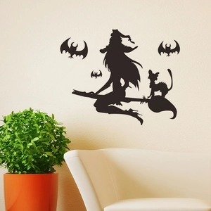 Halloween vinyl wall decal with flying witch, bats, and cat silhouette in home setting
