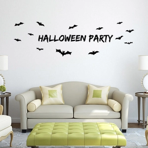 Halloween Party wall decals featuring black bat silhouettes above a modern living room sofa