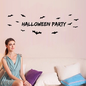 Halloween party wall sticker set with black bats and calligraphy lettering on a pink wall