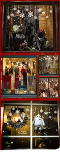Detailed view of white snowflake window clings and Merry Christmas stickers for decoration