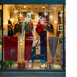 White Christmas hanging snowflake window decals and Merry Christmas lettering for display
