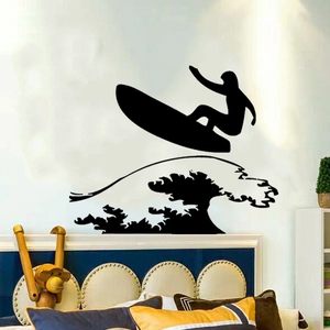 Detail view of surfing boy silhouette wall sticker on a bedroom wall decoration