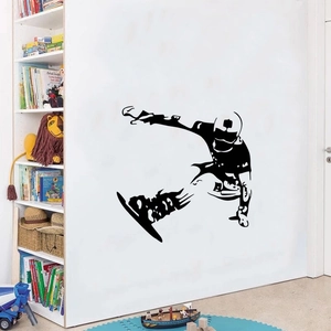 Detail of black vinyl skier silhouette wall sticker showing athlete jump in a boy's bedroom