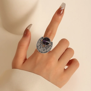 Bohemian vintage silver ring with large purple gemstone and floral engravings