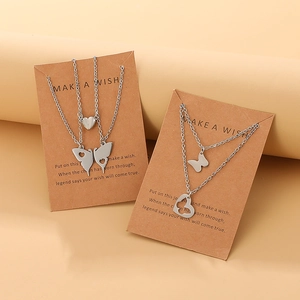 Stainless steel butterfly pendant necklace set for friends with heart cutout on kraft card