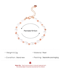 Detail view of pearl bracelet with rose gold charms and adjustable lobster clasp