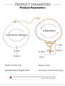 Detailed view of adjustable gold alloy bracelets featuring baroque pearls and bee pendant