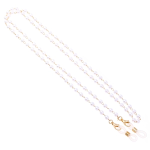 Close-up of white pearls eyewear chain with gold lobster clasps and silicone loops