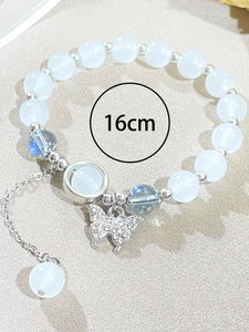 Detail of 16cm adjustable beaded bracelet with butterfly charm and moonstone beads