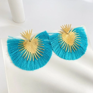 Bohemian gold sunburst earrings with bright turquoise fan-shaped silk tassels