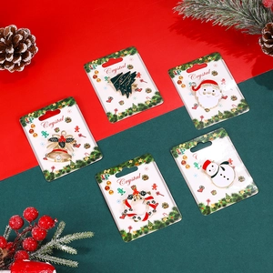 5-piece set of festive Christmas brooches including Santa, tree and wreath ornaments