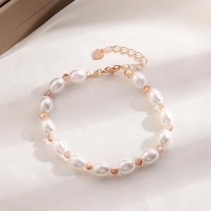 Handmade Baroque pearl bracelet with golden beads and a heart charm extension