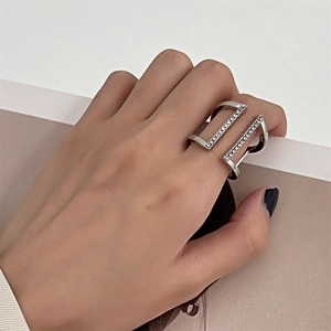 Minimalist double layer silver alloy ring with cubic zirconia on model finger