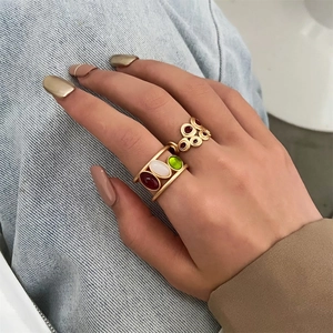 Retro gold plated adjustable rings set with colorful enamel stones on woman hand