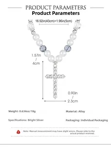 Detailed view of silver cross pendant with rhinestones and white pearl beads necklace