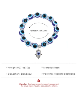 Detail of blue evil eye resin bead bracelet with Hamsa hand charm and size specs