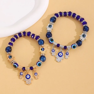 Bracelet ethnique avec perles Evil Eye et breloques Main de Fatma en or et argent