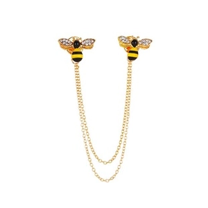 Detailed close-up of bee collar pins with golden chains and sparkling rhinestones