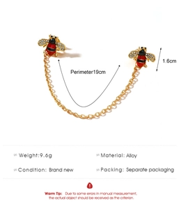 Detail of dual bee chain brooch with crystal wings and red black enamel abdomen
