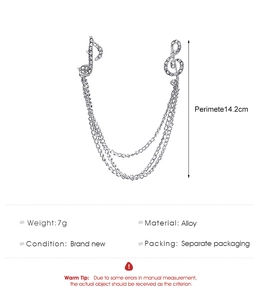 Detailed silver treble clef brooch with rhinestones and triple metal chain link