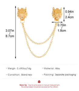 Detailed view of golden wolf head collar pin with double chains and size measurements