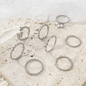 9-piece vintage silver ring set with butterfly motifs, rhinestones and faux pearls