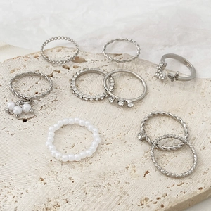 9-piece vintage silver ring set with rhinestones, pearls and butterfly designs