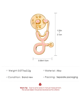 Macro shot showing dimensions and weight of the pink enamel stethoscope brooch pin