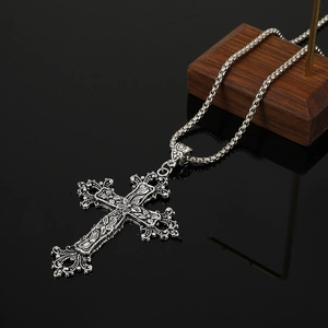 Gothic silver cross pendant necklace with ornate floral engravings and box chain
