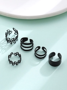 Detailed view of 5-piece black vintage C-shape ear cuffs with hollow leaf and layered designs