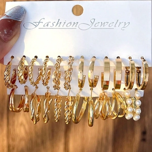 Set of 6 gold-toned geometric pearl earrings displayed on a fashion jewelry card