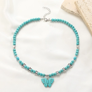 Bohemian turquoise beaded necklace with large butterfly pendant and silver accents