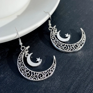 Retro hollow silver crescent moon and star drop earrings with scrollwork details