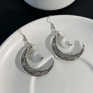 Vintage silver crescent moon and star drop earrings with ethnic filigree design