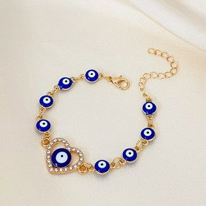 Turkish Evil Eye heart bracelet in gold plating with sparkling zircon heart charm and blue beads
