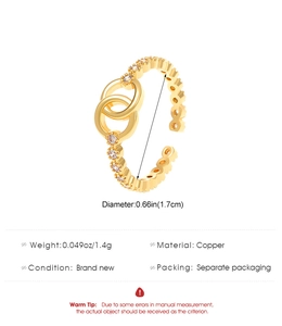 Detail of gold double-circle ring with micro-set zircons and adjustable copper band