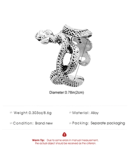 Detailed view of vintage snake ring showing intricate scales and silver finish texture