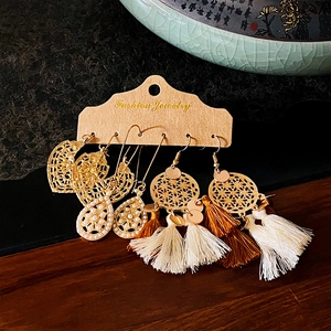 Vintage bohemian earrings set with geometric hollow designs and tassel pendants